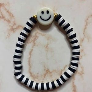 black and white clay bead bracelet with smiley face